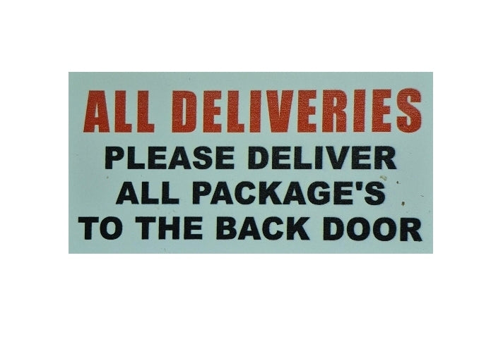 PLEASE DELIVER ALL PACKAGES TO THE BACK DOOR sign